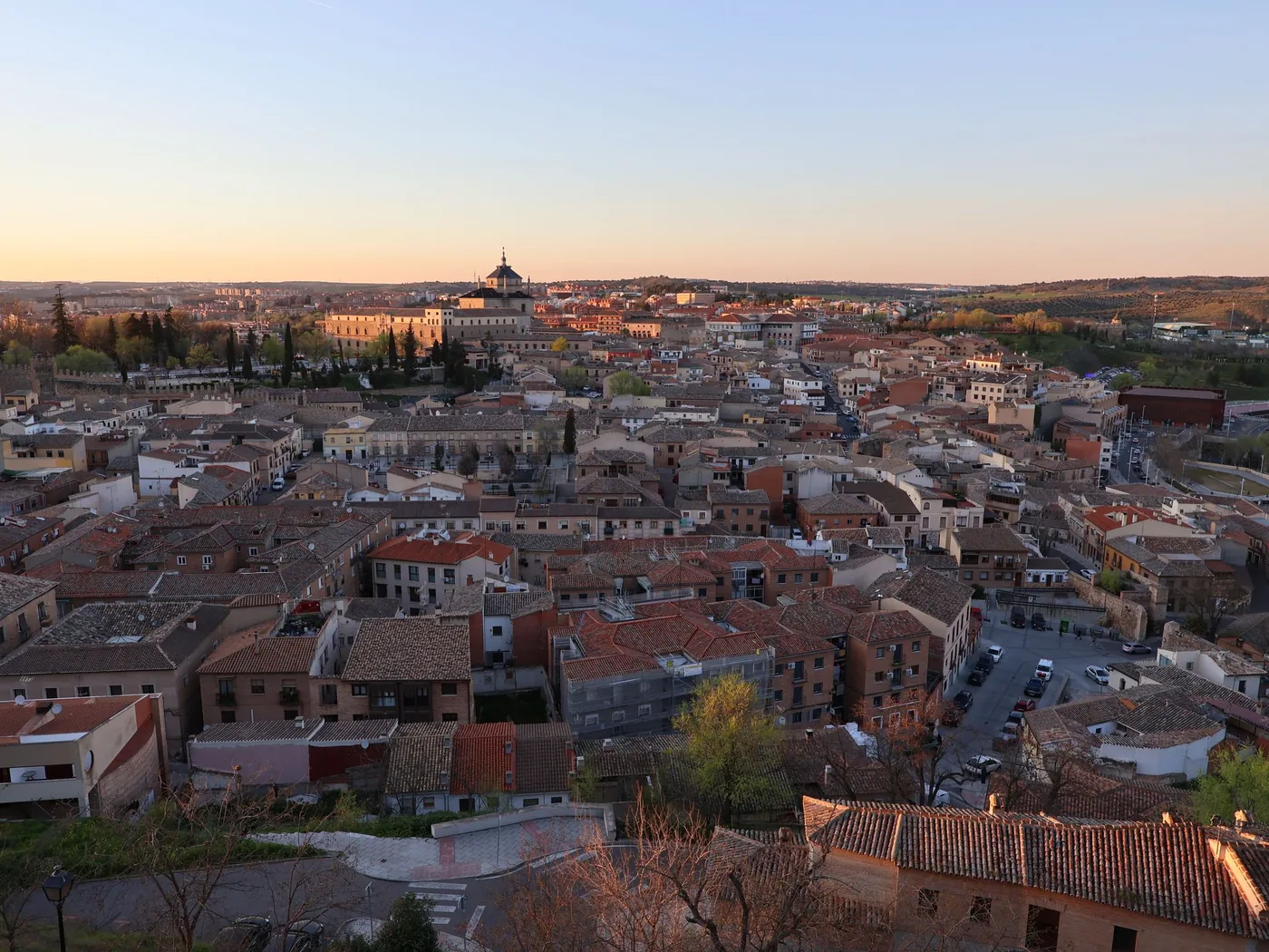 The skyline of Toledo above the Tagus river at golden hour