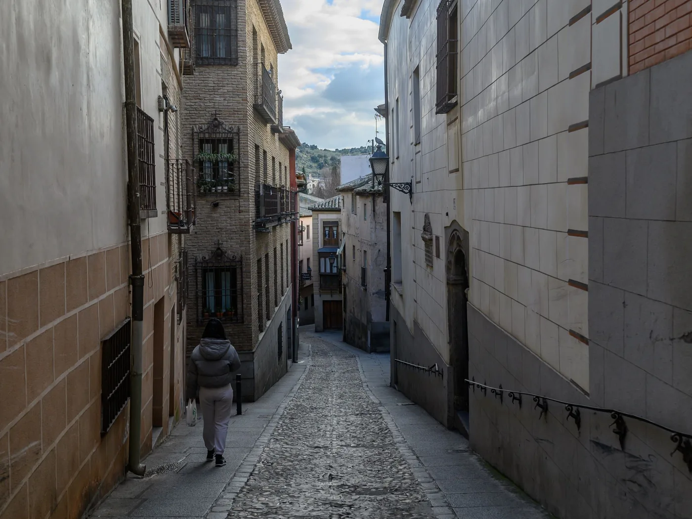 A narrow cobbled street in the old town of Toledo